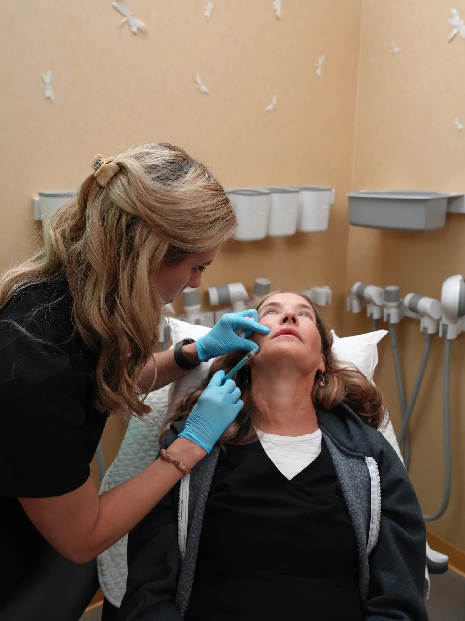Megan Sosnick placing dermal filler at the cheek at Reviv Med Spa, Millbrae
