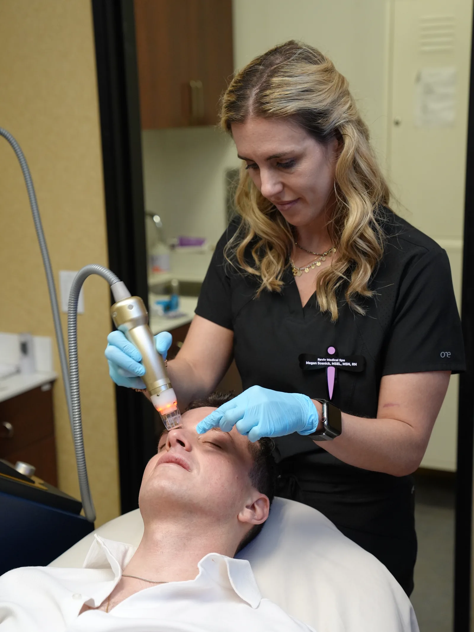Megan Sosnick guiding the Sylfirm X handpiece across the forehead at Reviv Med Spa, Millbrae