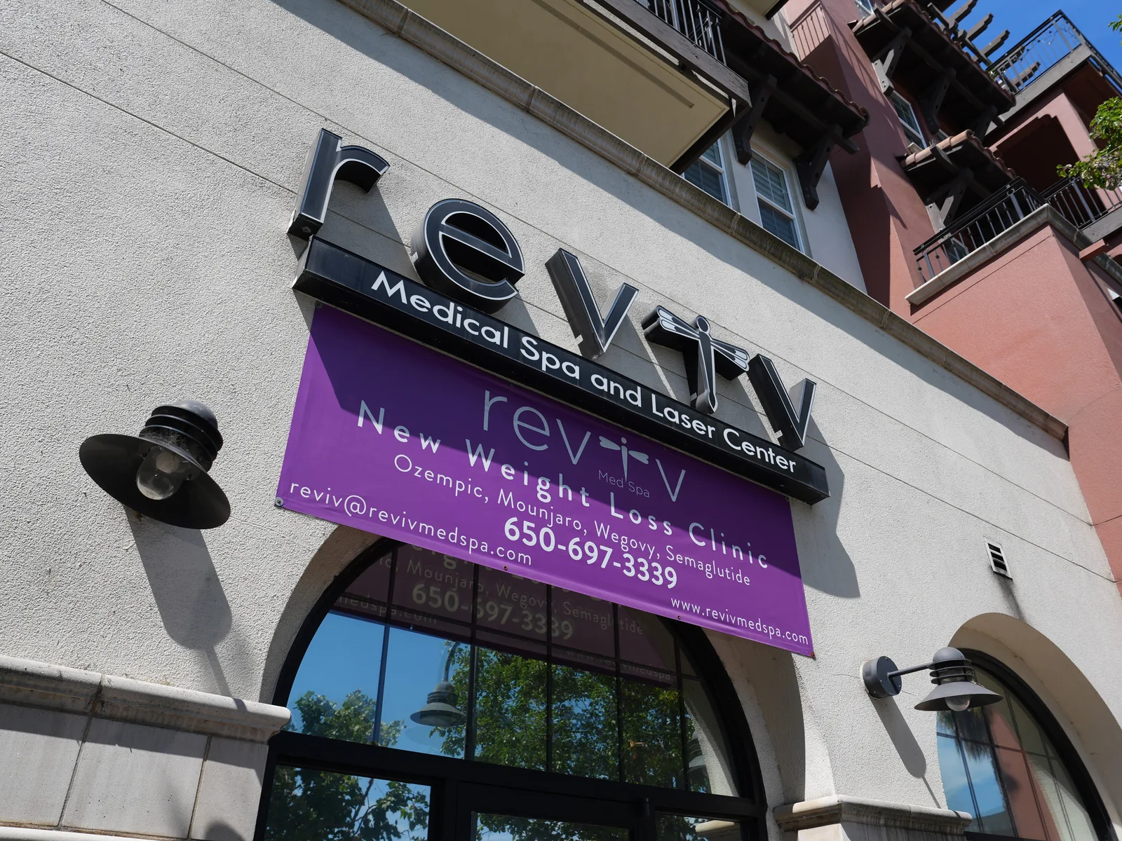 The weight loss clinic sign on the storefront of Reviv Med Spa, El Camino Real, Millbrae